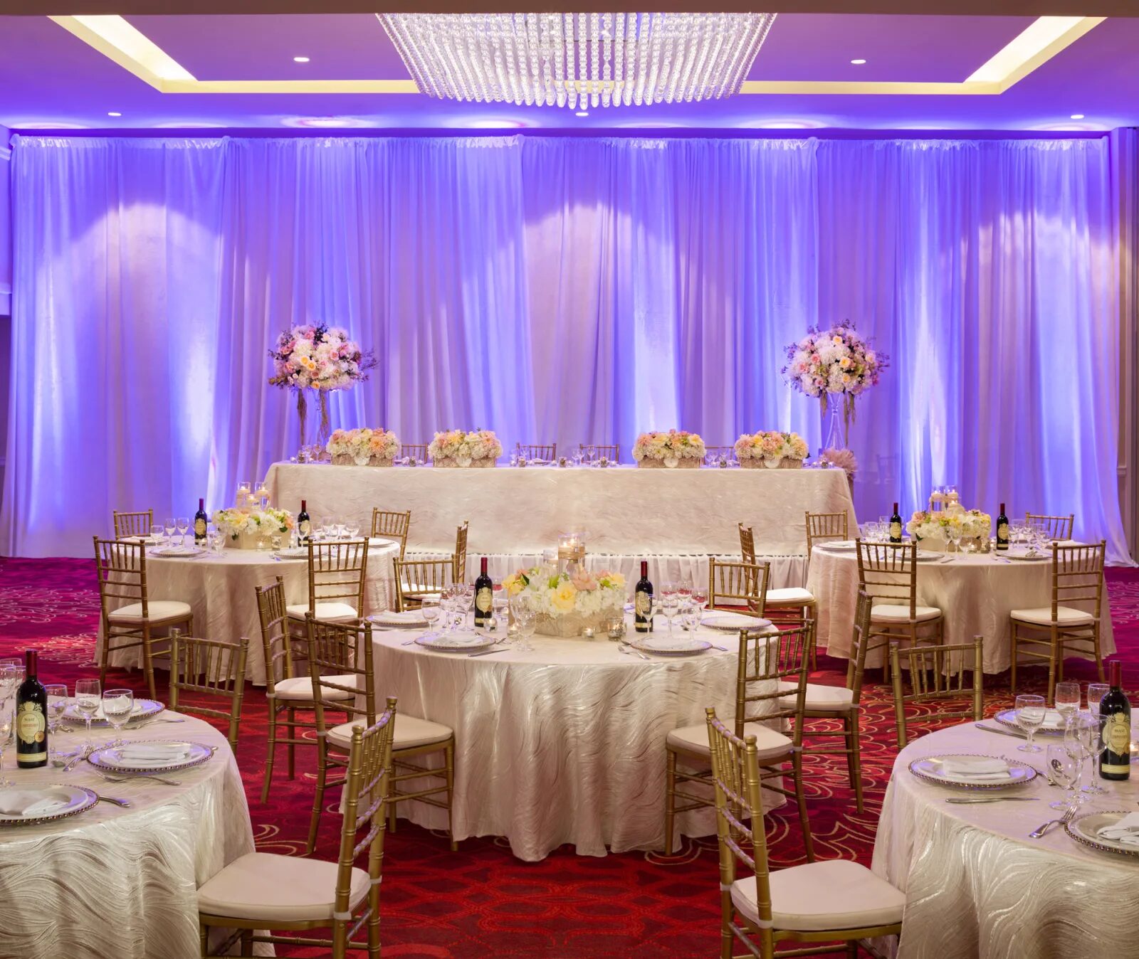 Harbourfront Ballroom wedding reception with round banquet tables and uplighting